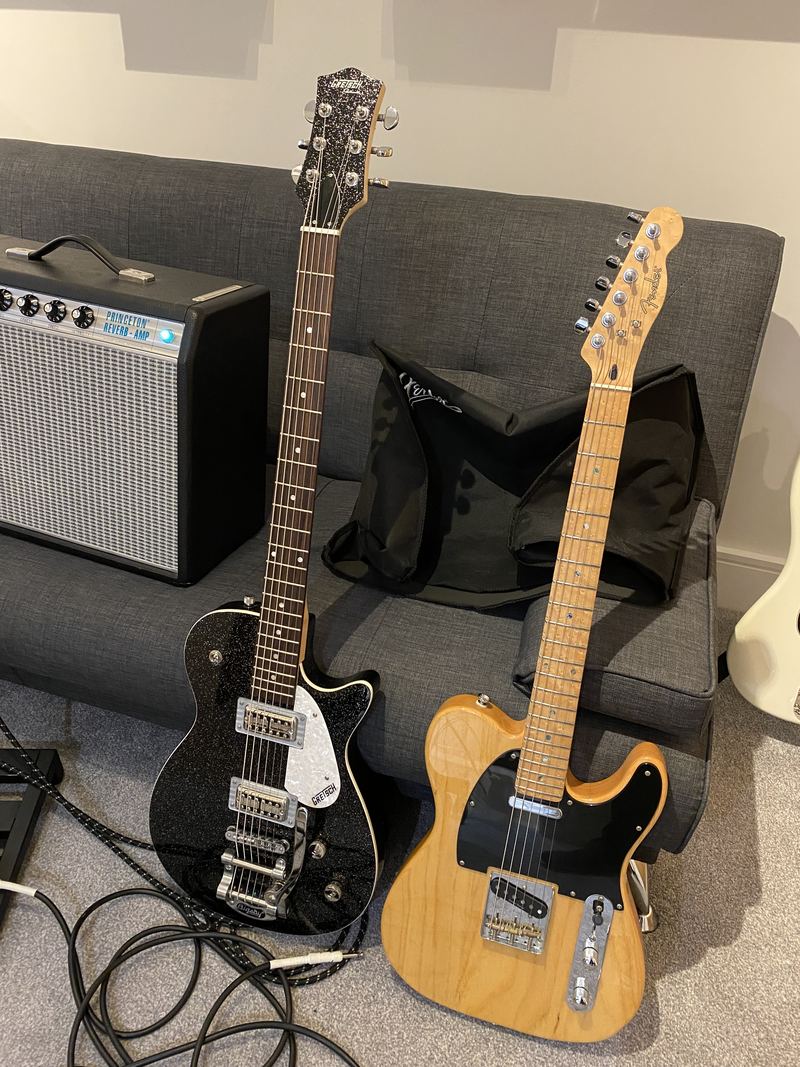 Tom's electric guitars on stands